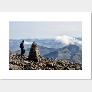 Climber passes a cairn on the summit of Ben Nevis Posters and Art